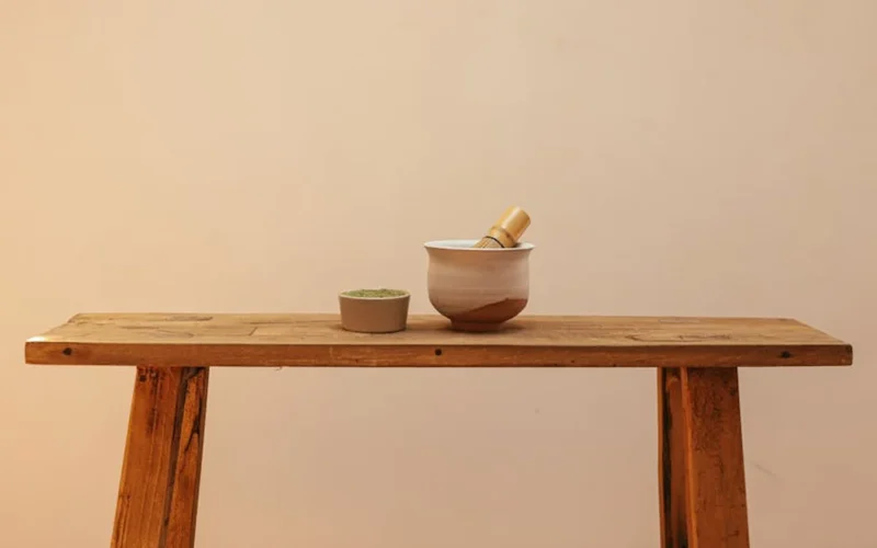 A steaming matcha bowl in a traditional Japanese cup with soft natural light.