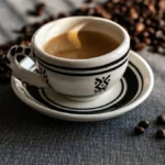 Defne Ceyda Okay pours coffee into a traditional Turkish cup in a minimalist setting with natural light.