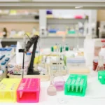 Scientific analysis of coffee sample in modern lab setting with digital measurements and LED lighting.