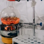 Electrodes in coffee demonstrating scientific measurement technique in a lab environment.