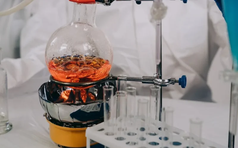 Electrodes in coffee demonstrating scientific measurement technique in a lab environment.