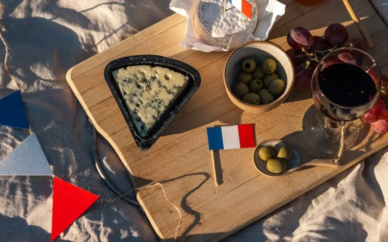 Costco wine display featuring seafood and cheese with a sommelier holding a glass under natural light