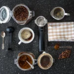 Cold brew coffee being prepared in an industrial kitchen using a Toddy commercial system under neon lighting.