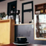Vibrant Yemeni coffee shop with traditional brewing setup and gathered customers.
