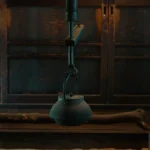 A clay teapot steaming with puer tea on a bamboo tray in a traditional Chinese tea room with soft lighting.