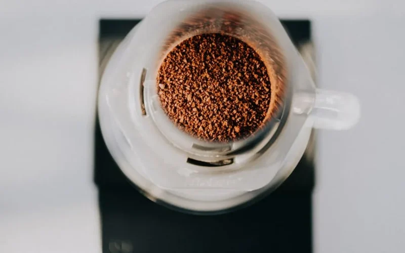 Cold brew dripping from Hive Brew One into glass in minimalist kitchen setting.