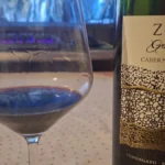 Close up of red wine being poured into a premium crystal tasting glass