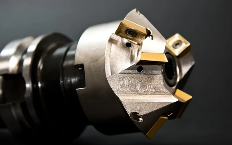 Close-up view of stainless steel machine components showing a small gap between plates.
