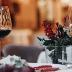 A glass of Alsatian white wine and Côtes du Rhône red wine paired with spicy food.