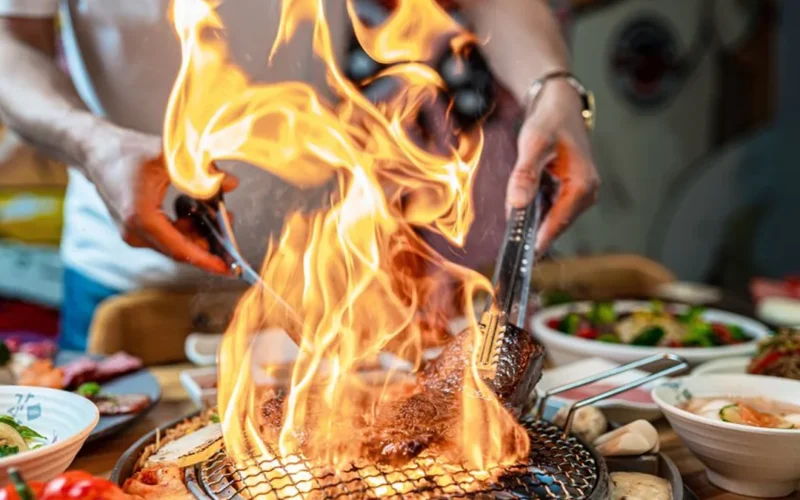 Professional server performing tableside carving service at a fine dining restaurant table.