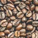 Comparison of light roast coffee in glass and dark roast coffee in ceramic mug.