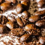 Roasted specialty coffee beans beside white nutritional supplement powder on a dark textured background.