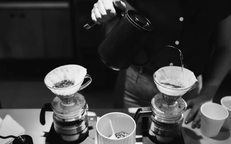 Close up of a Hario V60 NEO dripper on a glass carafe during coffee brewing.