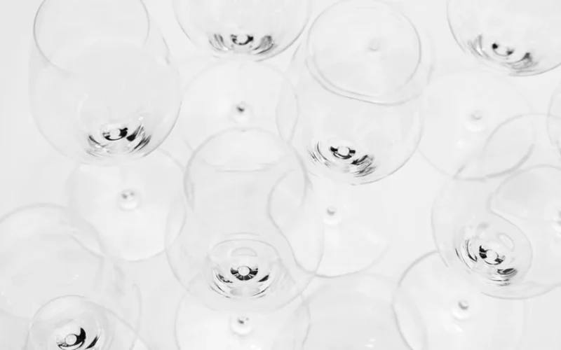 Deep amber colored aged Riesling wine in a crystal glass on slate.