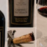 A glass of deep red Napa Cabernet Sauvignon on a dark wooden surface.