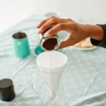 Close up of manual pour over coffee brewing in a specialty cafe setting.