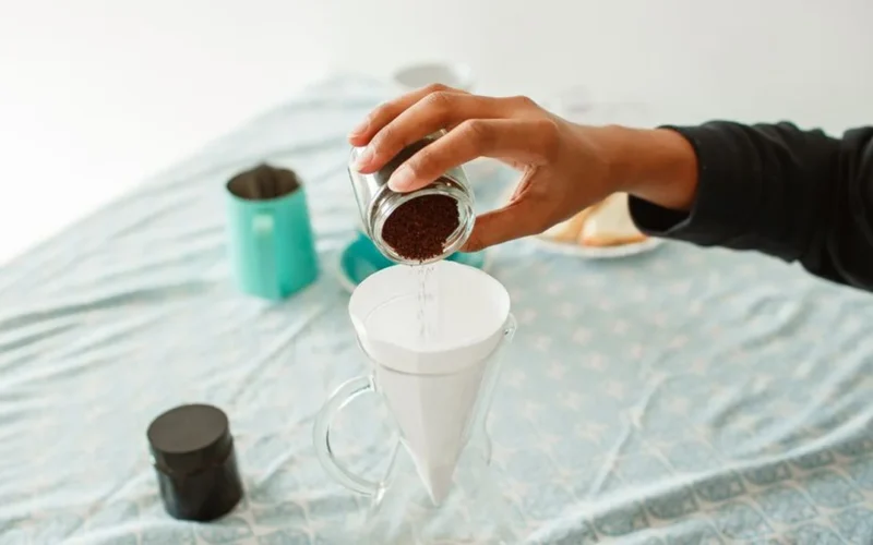 Close up of manual pour over coffee brewing in a specialty cafe setting.