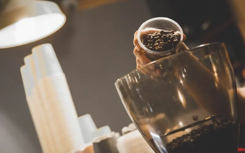 Person using an AeroPress to brew manual pour-over coffee in Mexico City.