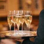 A bottle of Nyetimber Blanc de Blancs and a glass of English sparkling wine.