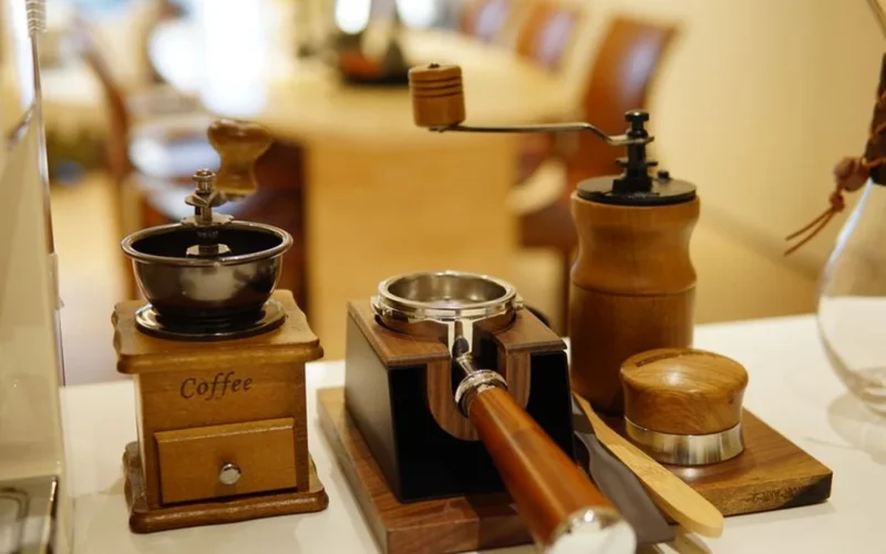 Specialized coffee tasting coasters and a ceramic cup of coffee on a wooden table.