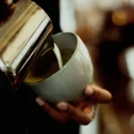 Close up of a Philips LatteGo milk carafe containing liquid dairy milk without froth.