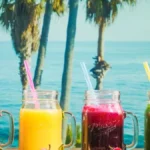 A collection of antioxidant rich drinks including coffee, hibiscus tea, and berry juice.