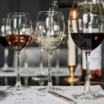 Assorted white wine and sparkling wine glasses on a restaurant table in Matosinhos.