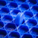 Macro close-up of bubbled and deformed black plastic components showing signs of thermal damage.