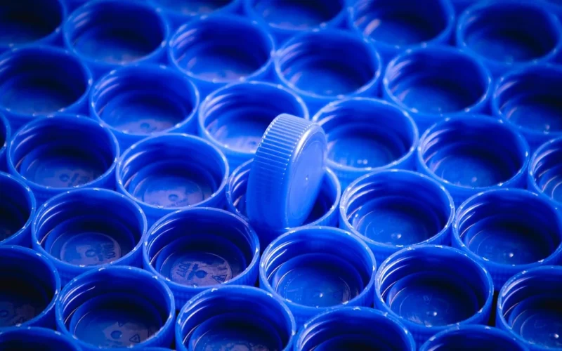 Macro close-up of bubbled and deformed black plastic components showing signs of thermal damage.