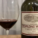 Macro close-up of deep red wine liquid showing rich texture and dark color.