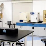 A high-tech coffee research laboratory with specialized brewing equipment and scientific glassware on clean laboratory c