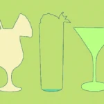 A sophisticated nonalcoholic cocktail with rosemary and citrus on a dark marble bar surface.